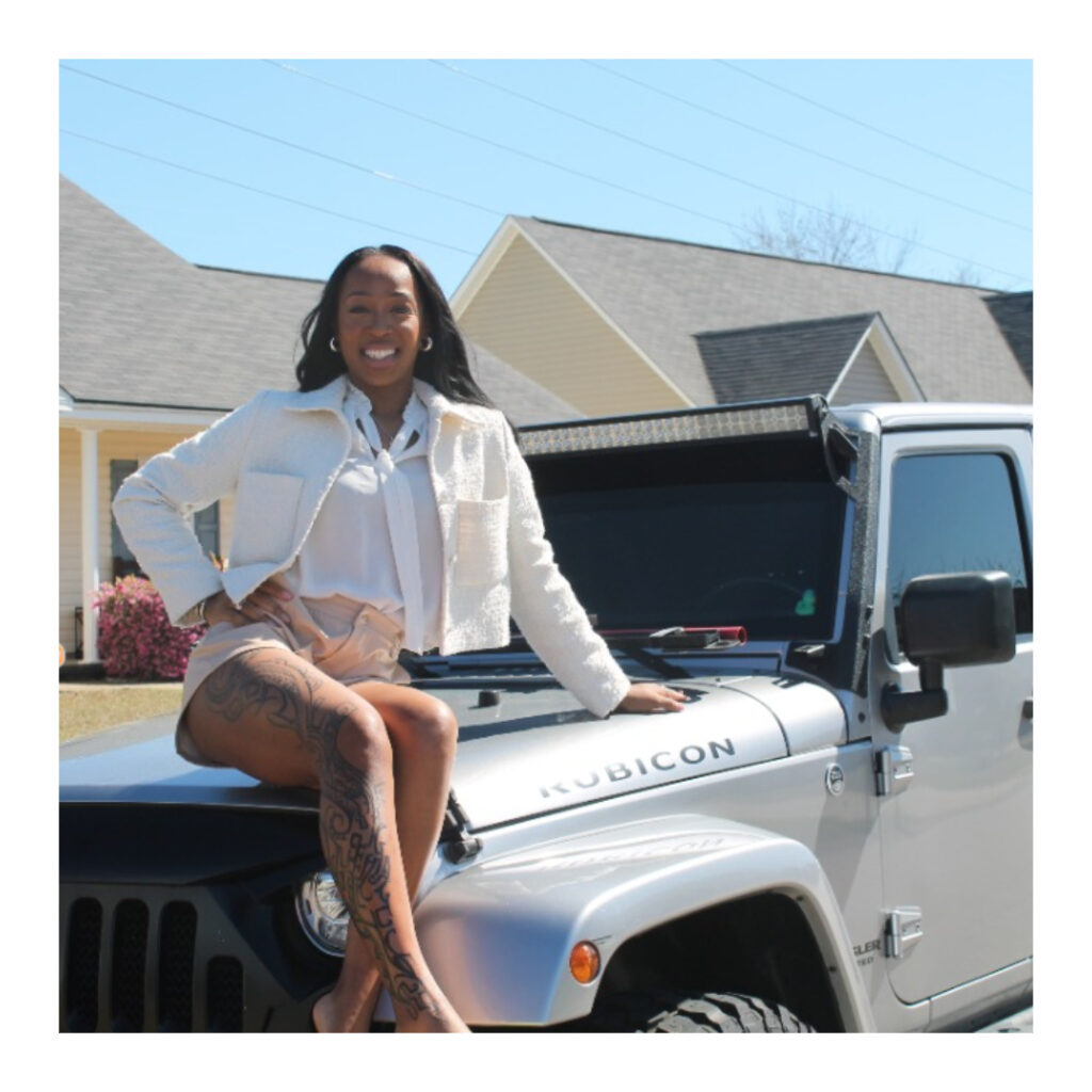 Southern Lux Jeephers club member sitting on her custom Jeep.